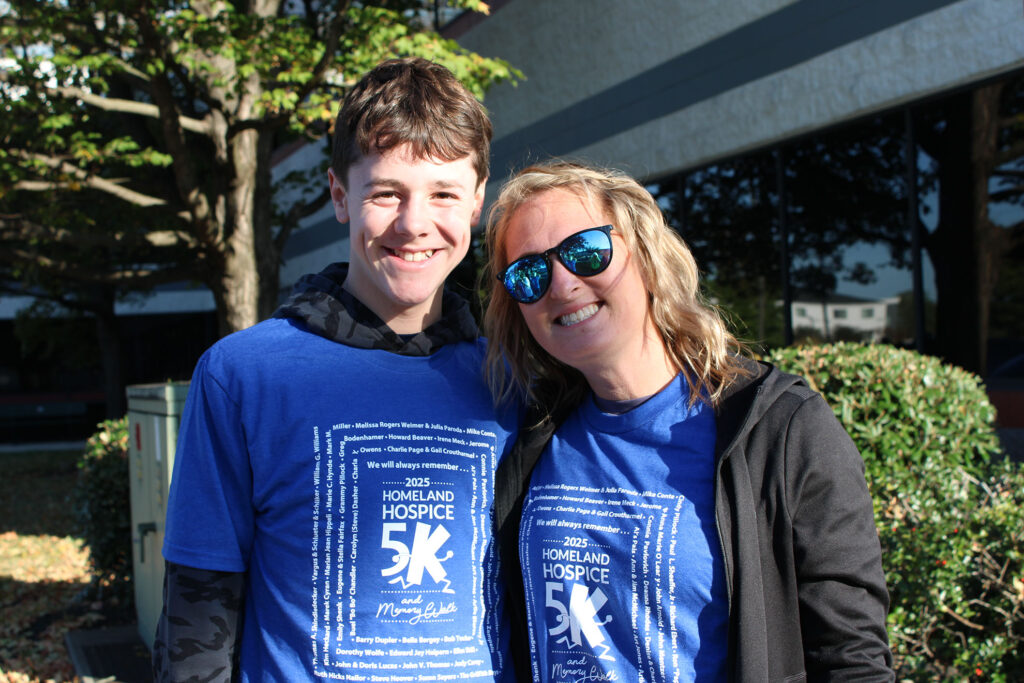 pair of event participants smiling together